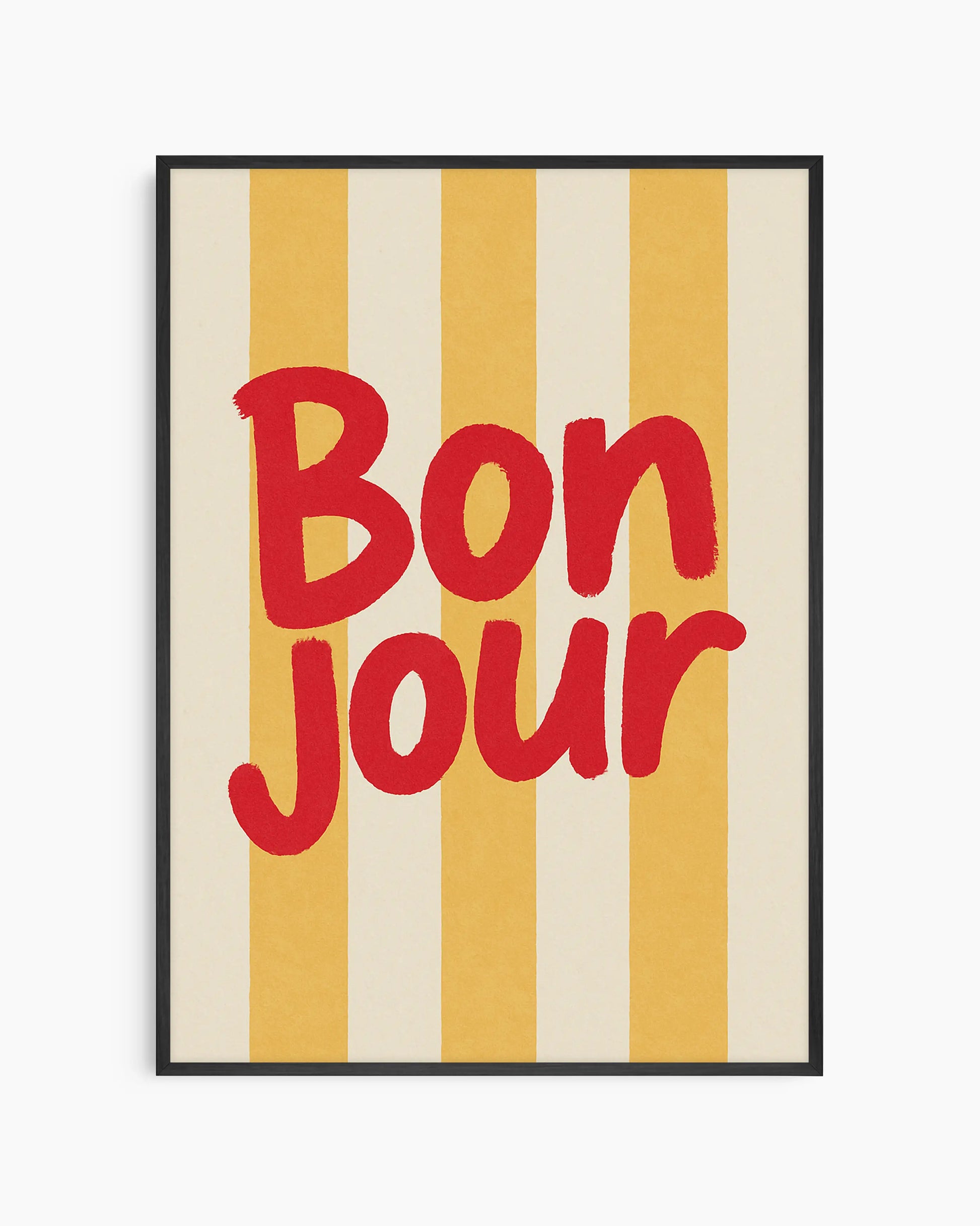 Barntavla med texten "BON JOUR" i rött på gul- och crèmefärgade vertikala ränder, inramad i svart träram. En glad och stilren barnrumstavla.