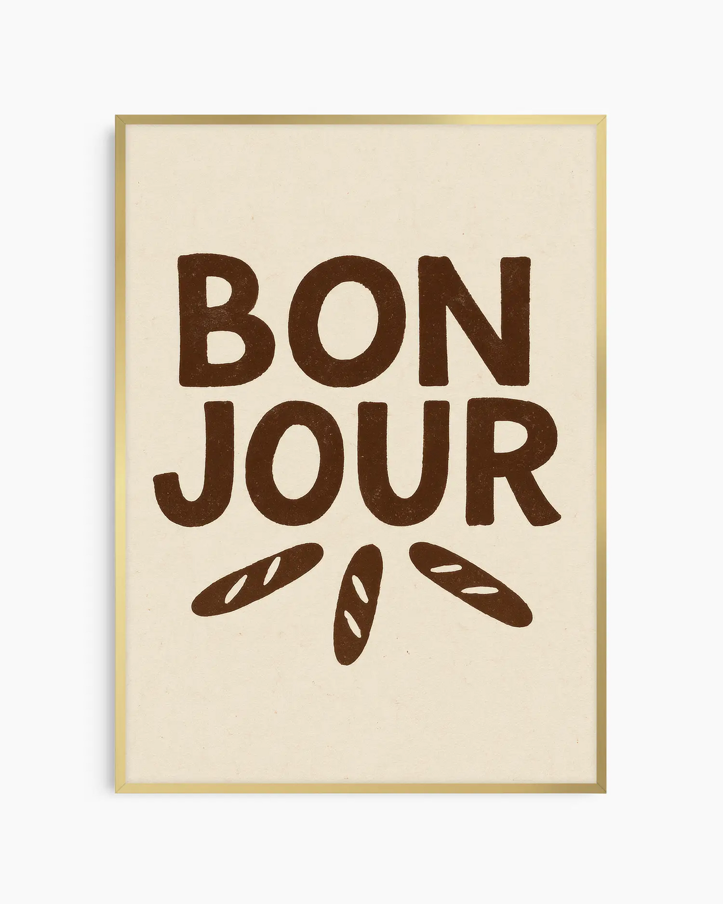 Barntavla med texten "BON JOUR" i mörkbrun text och tre små baguetter på ljus bakgrund, inramad i guld aluminiumram. En söt och lite lyxig väggdetalj.