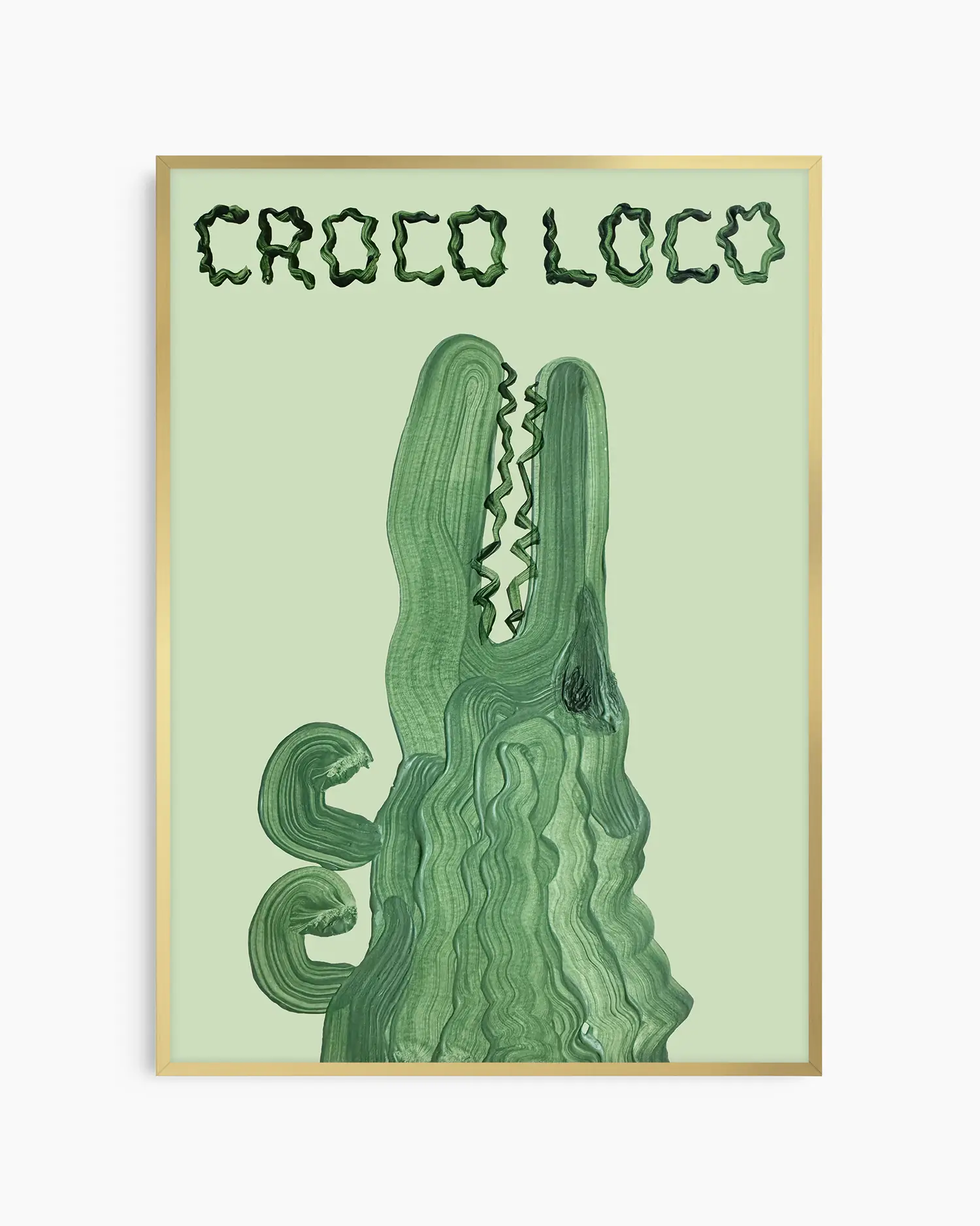 Barntavla med grön krokodil i penseldragsstil och texten “CROCO LOCO”, inramad i guld aluminiumram. En unik och kreativ dekoration med humoristisk touch.