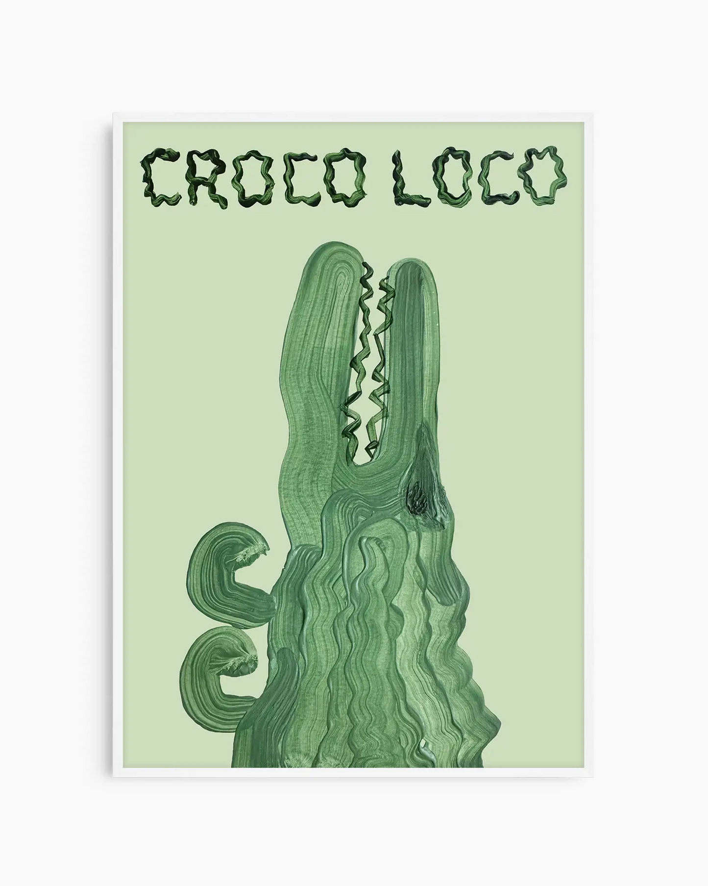 Barntavla med en grön krokodil och texten “CROCO LOCO” på ljusgrön bakgrund, inramad i vit träram. En lekfull och glad tavla för barnrummet.