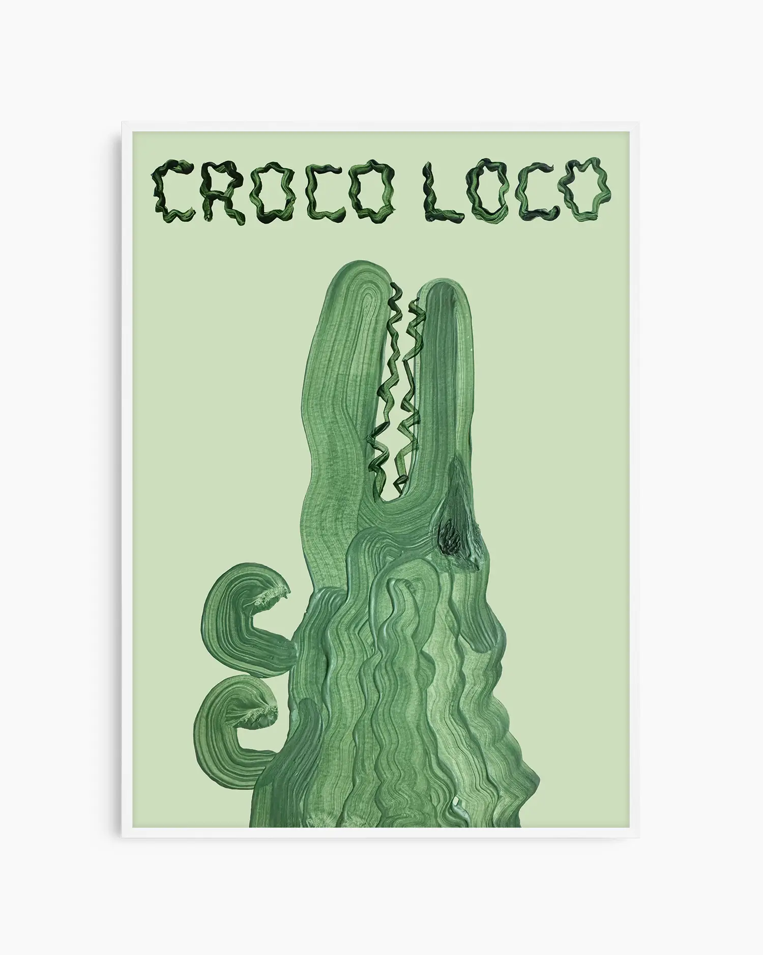 Barntavla med en grön krokodil och texten “CROCO LOCO” på ljusgrön bakgrund, inramad i vit träram. En lekfull och glad tavla för barnrummet.