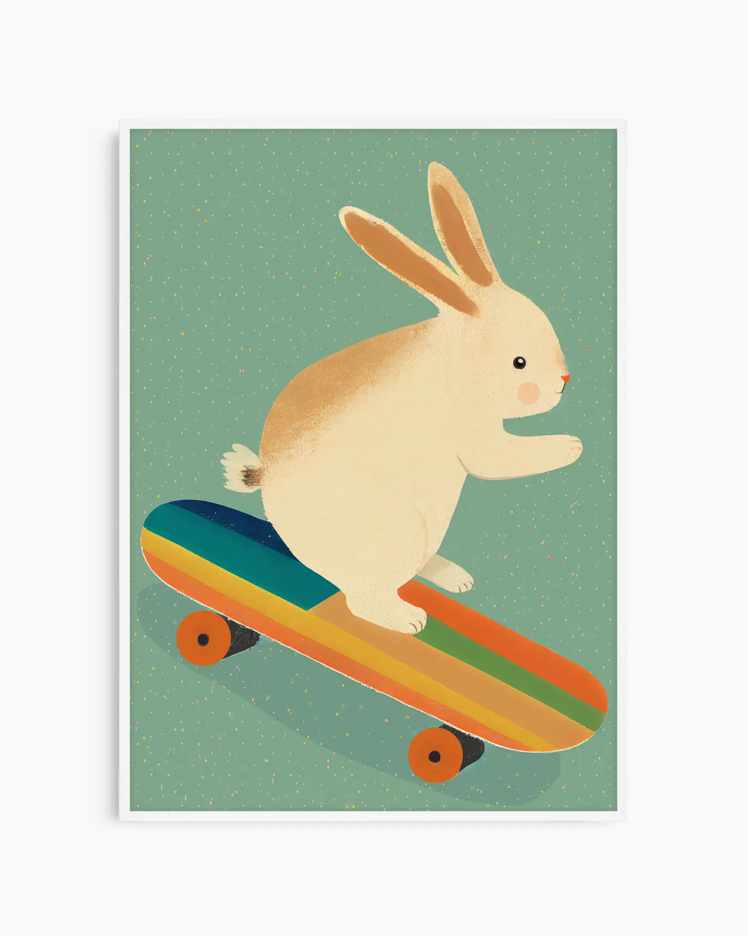 Barntavla med söt kanin på regnbågsrandig skateboard, inramad i vit träram som skapar en ljus och mjuk känsla på väggen.