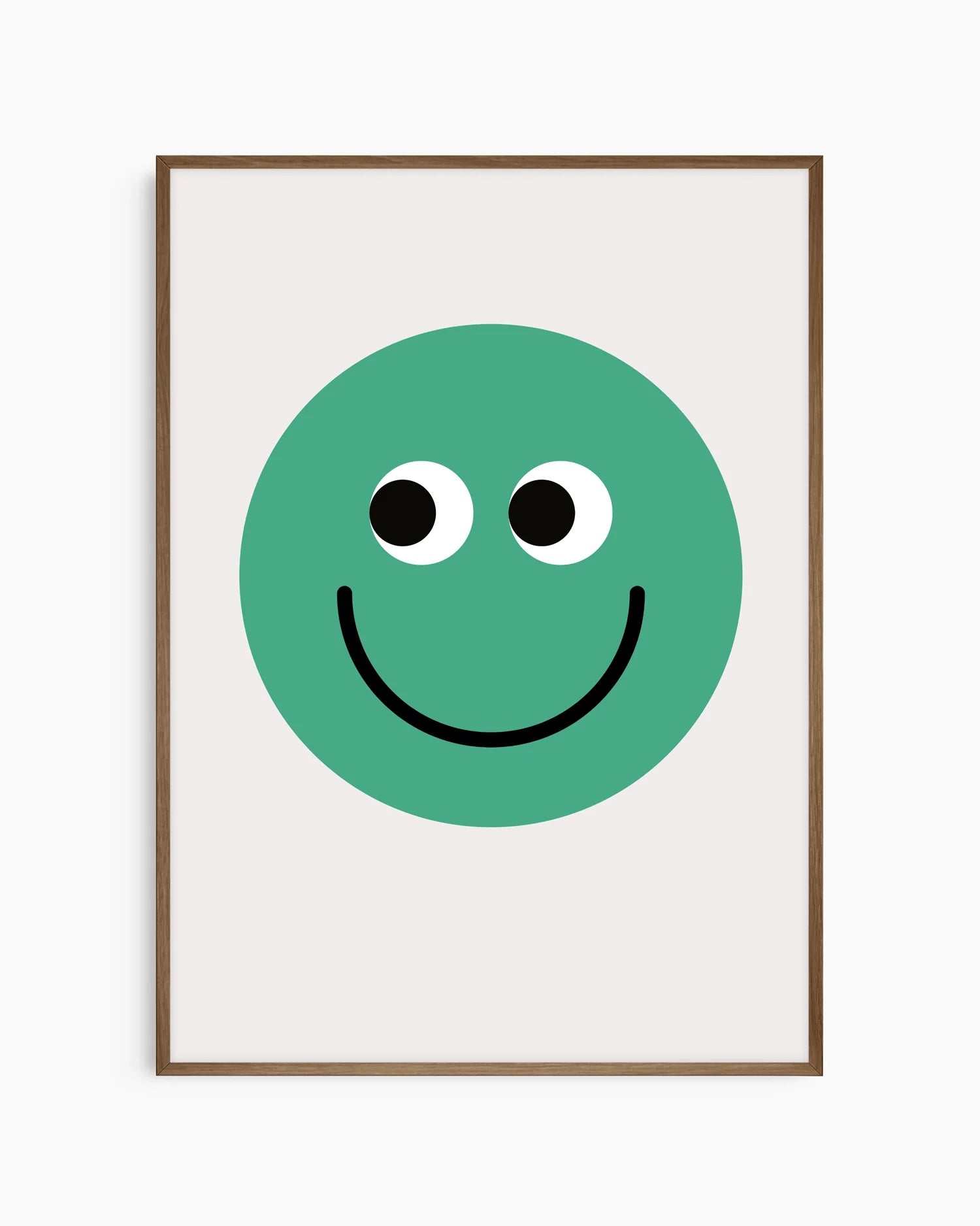 Barntavla med enkel grön smiley, inramad i mörk ekram som tillför värme och kontrast.
