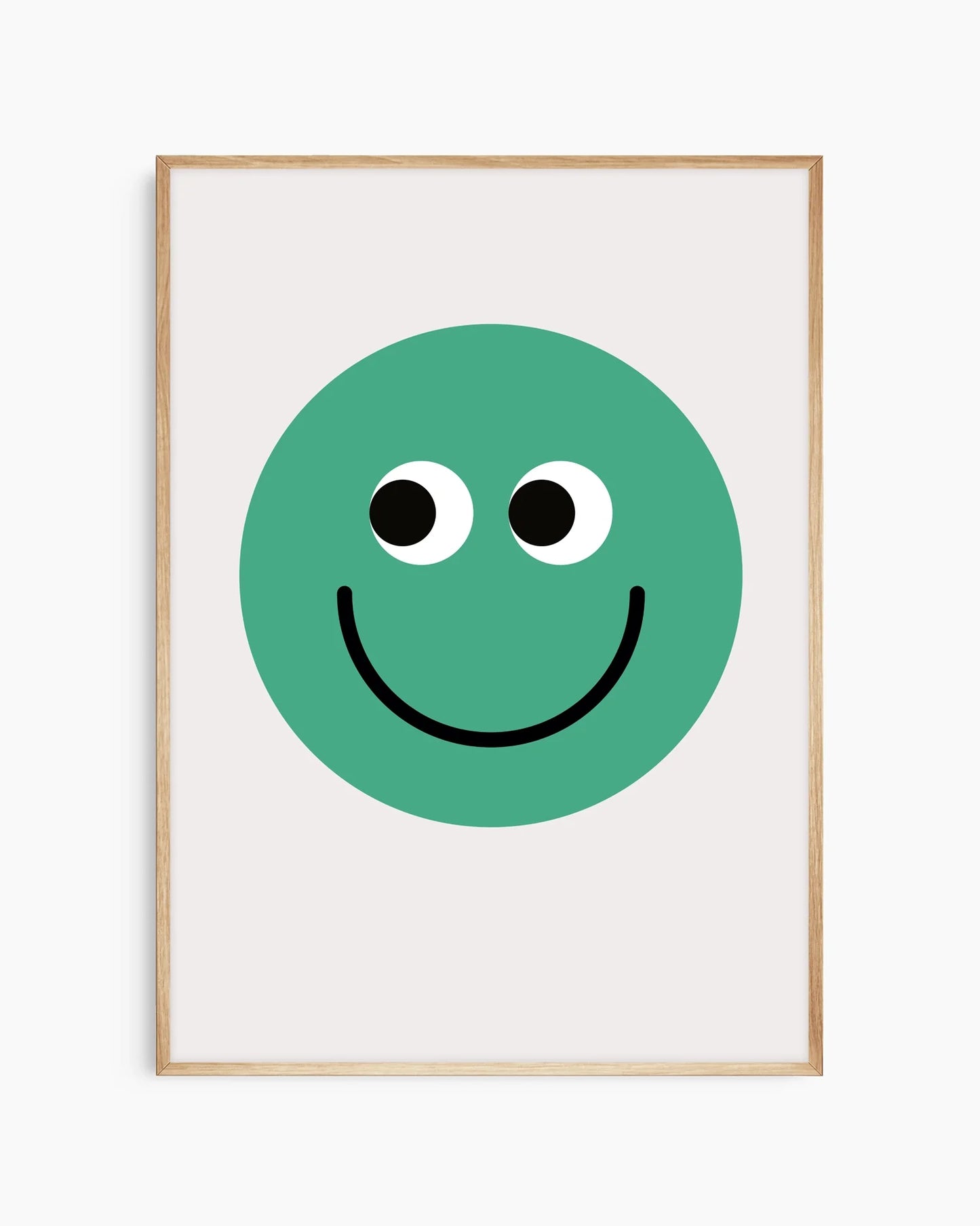 Barntavla med tydlig grön smiley, inramad i ekram som skapar ett mjukt och harmoniskt intryck.