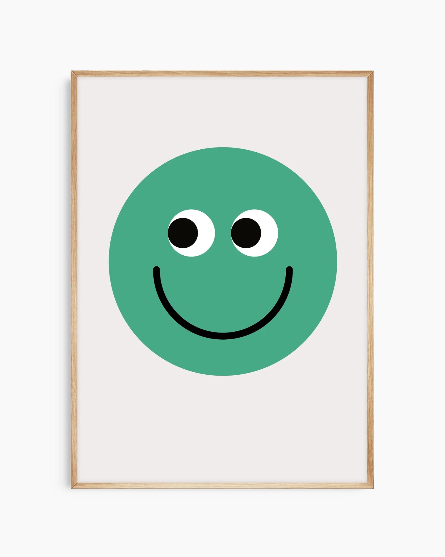 Barntavla med tydlig grön smiley, inramad i ekram som skapar ett mjukt och harmoniskt intryck.