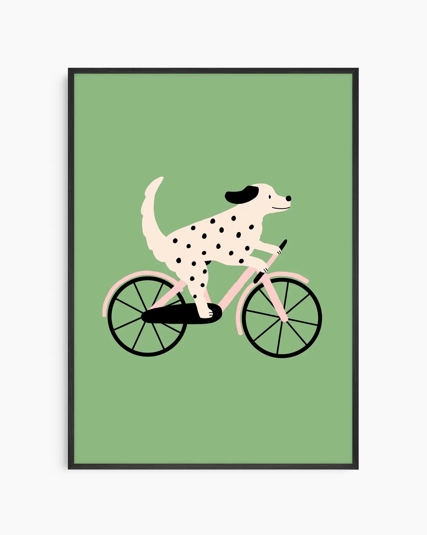 Barntavla med en prickig hund som cyklar, inramad i svart träram mot grön bakgrund.