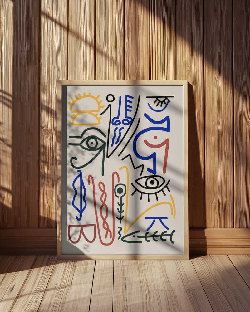 Inramad barntavla med färgstarka symboler placerad på golvet i ett barnrum med träpanel på väggen, vilket skapar en varm och harmonisk helhet.
