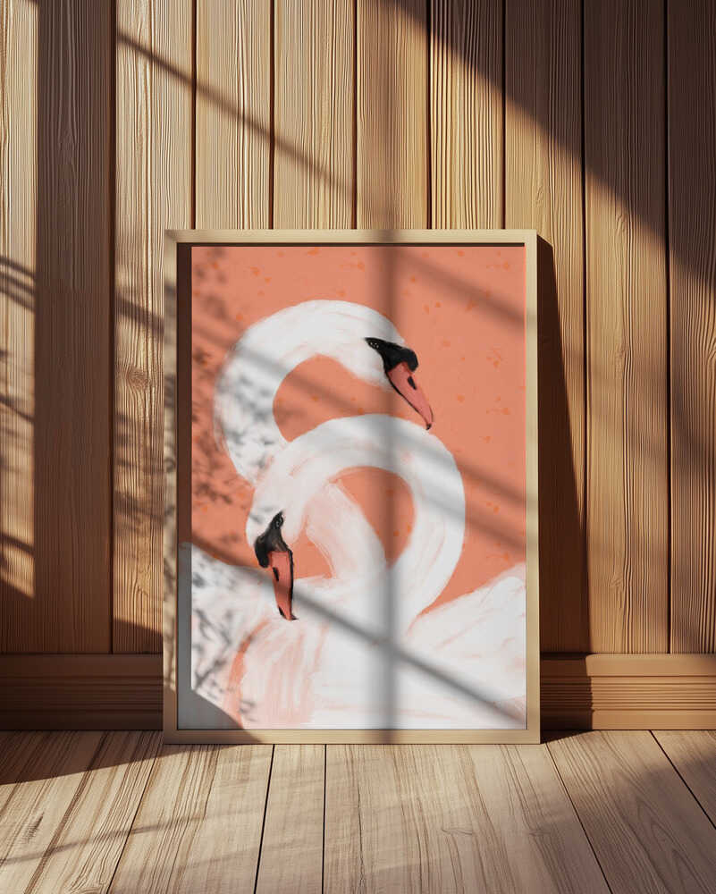 Inramad barntavla med svanar placerad mot träpanel, där det aprikosa motivet kontrasterar fint mot de naturliga tonerna.