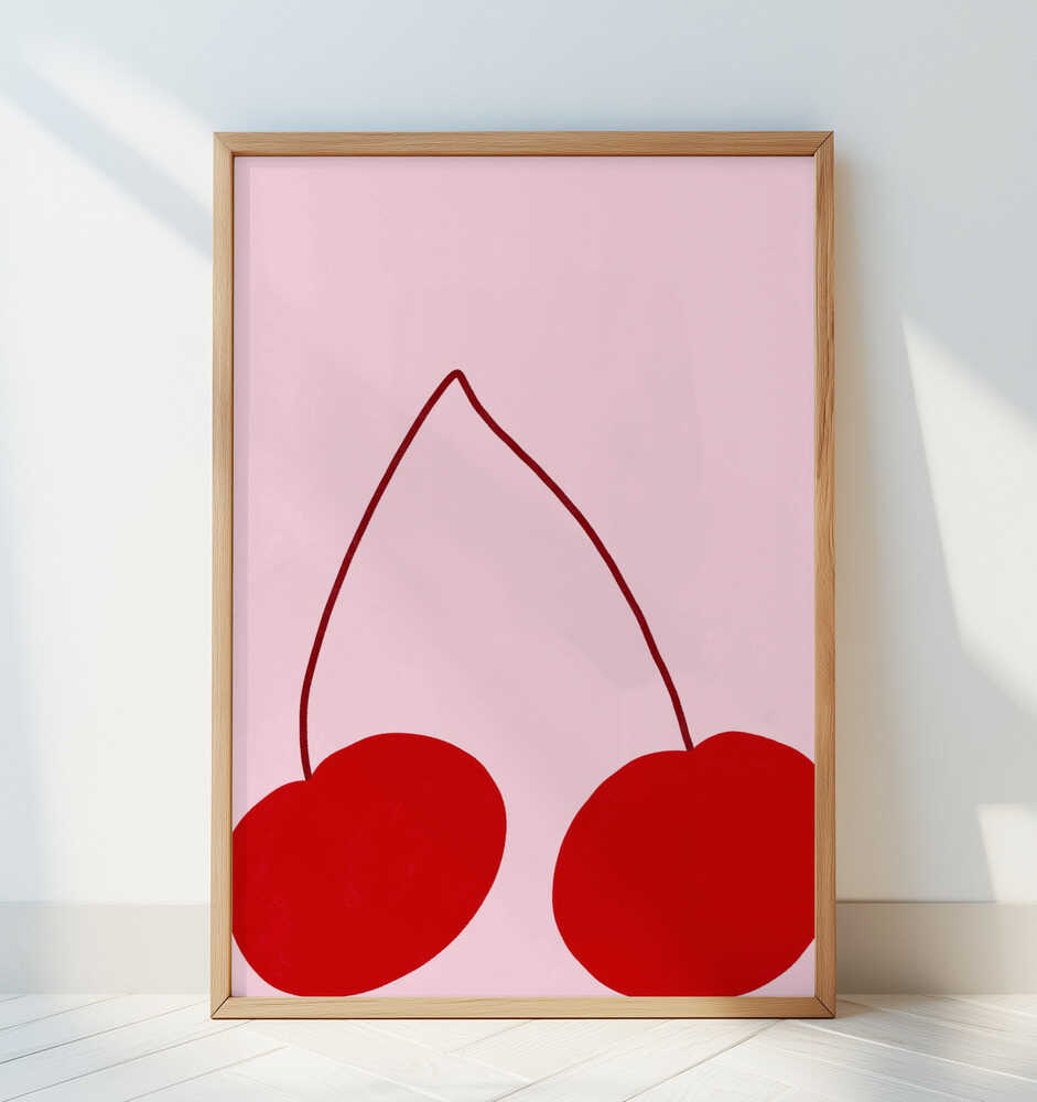 Barntavla med röda körsbär på rosa bakgrund lutad mot en vit vägg och skapar ett rent och lekfullt intryck.