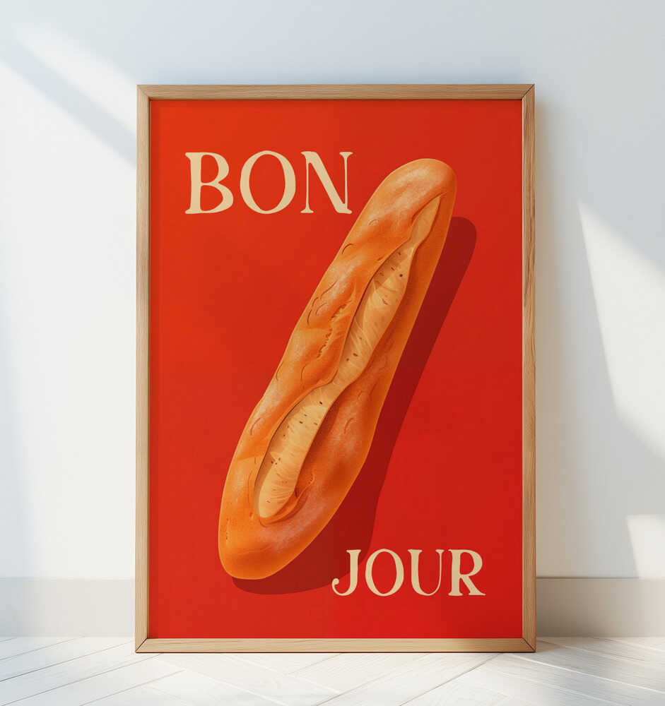 Barntavla med baguette och texten "BON JOUR", lutad mot en vit vägg i ett ljust rum. Den röda färgen skapar en varm kontrast mot den minimalistiska miljön.